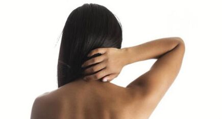 The girl shows her neck from the back of the back